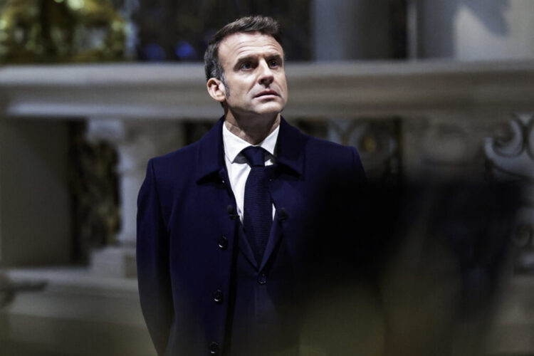 French President Emmanuel Macron looks up during a visit of Notre-Dame de Paris cathedral in Paris, on November 29, 2024. The Notre-Dame Cathedral is set to re-open early December 2024, with a planned weekend of ceremonies on December 7 and 8, 2024, five years after the 2019 fire which ravaged the world heritage landmark and toppled its spire. Some 250 companies and hundreds of experts were mobilised for the five-year restoration costing hundreds of millions of euros. (Photo by STEPHANE DE SAKUTIN / POOL / AFP)