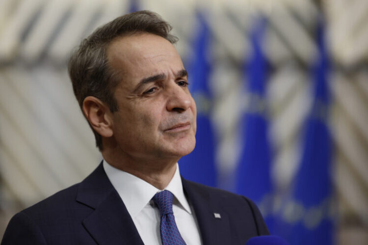 Greece's Prime Minister Kyriakos Mitsotakis speaks with the media as he arrives for an EU summit at the European Council building in Brussels, Thursday, Dec. 19, 2024. (AP Photo/Geert Vanden Wijngaert)