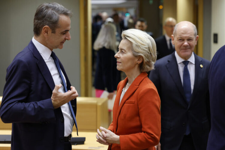 Greece's Prime Minister Kyriakos Mitsotakis, left, speaks with European Commission President Ursula von der Leyen during a round table meeting during an EU-Western Balkans summit in Brussels, Wednesday, Dec. 18, 2024. (AP Photo/Geert Vanden Wijngaert)