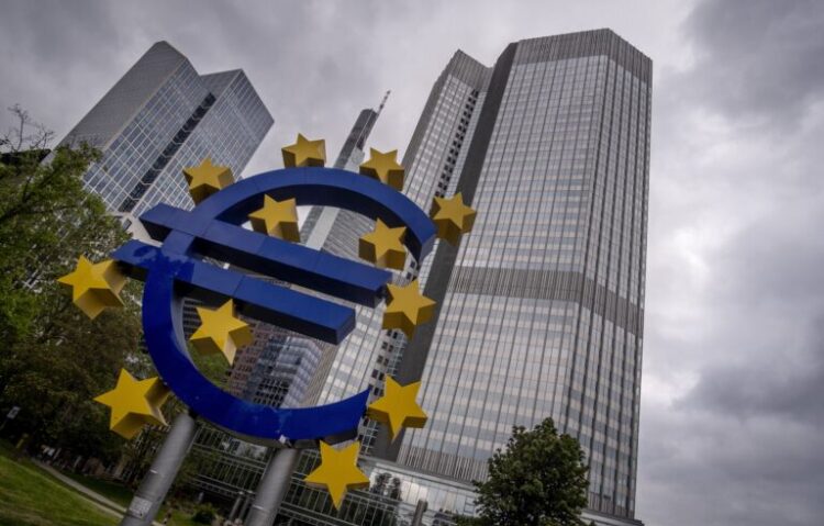 The Euro sculpture stands in front of the former headquarters of the European Central Bank (ECB) in Frankfurt, Germany, Tuesday, May 23, 2023. The ECB celebrates its founding date 25 years ago on Wednesday. (AP Photo/Michael Probst)