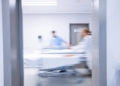 5589683629448550 doctors-and-nurse-pushing-emergency-stretcher-bed-in-corridor